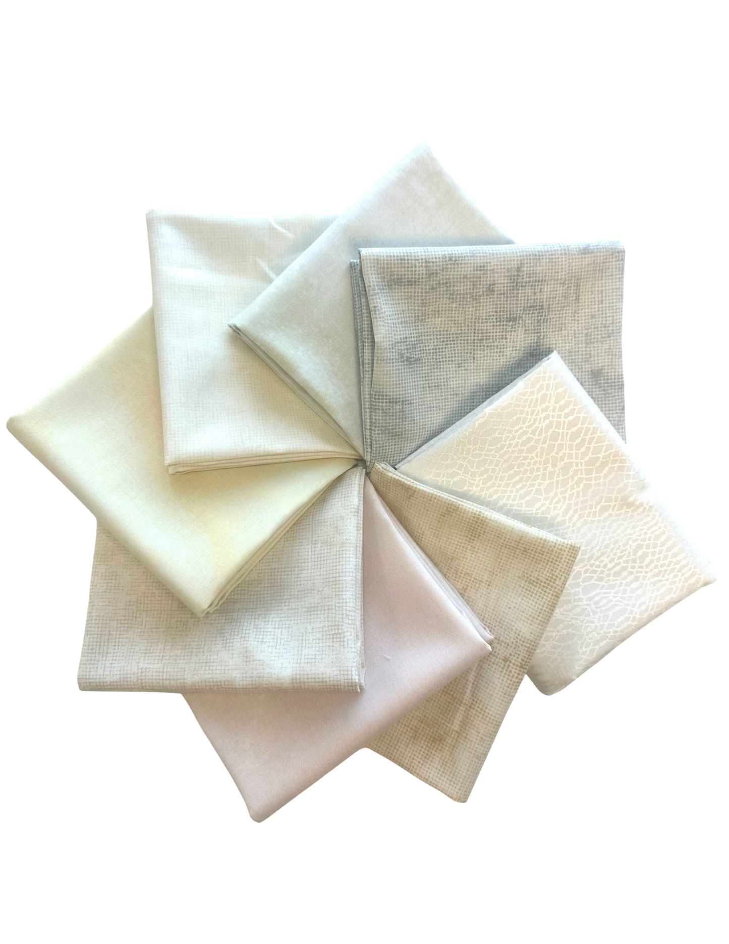 light pale toned half yard cut fabrics inspired by the pantone color of the year, cloud dancer. SKY ombre and chalk and charcoal fabrics designed by jennifer sampou quilter.